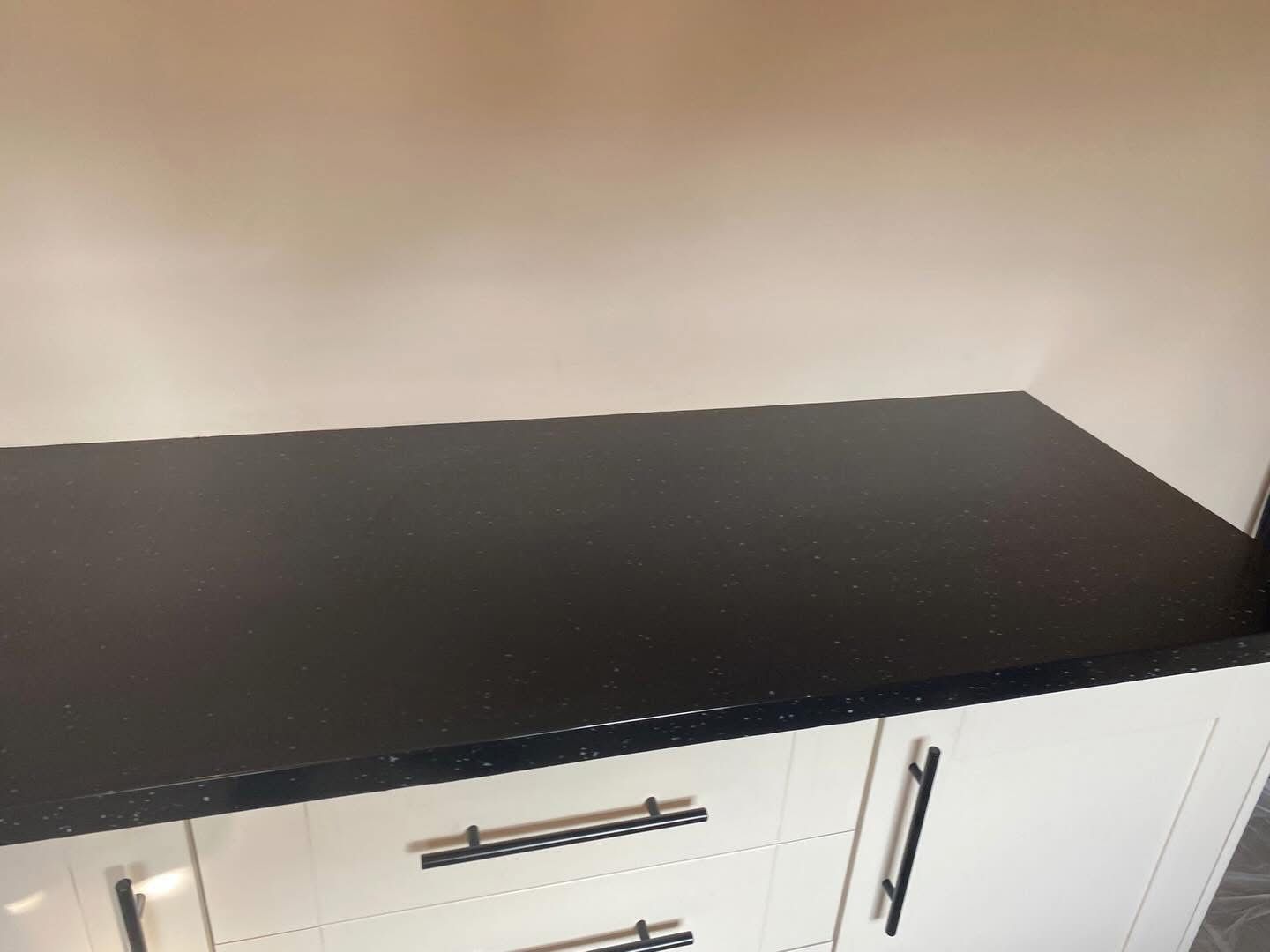 Black gloss worktop close up