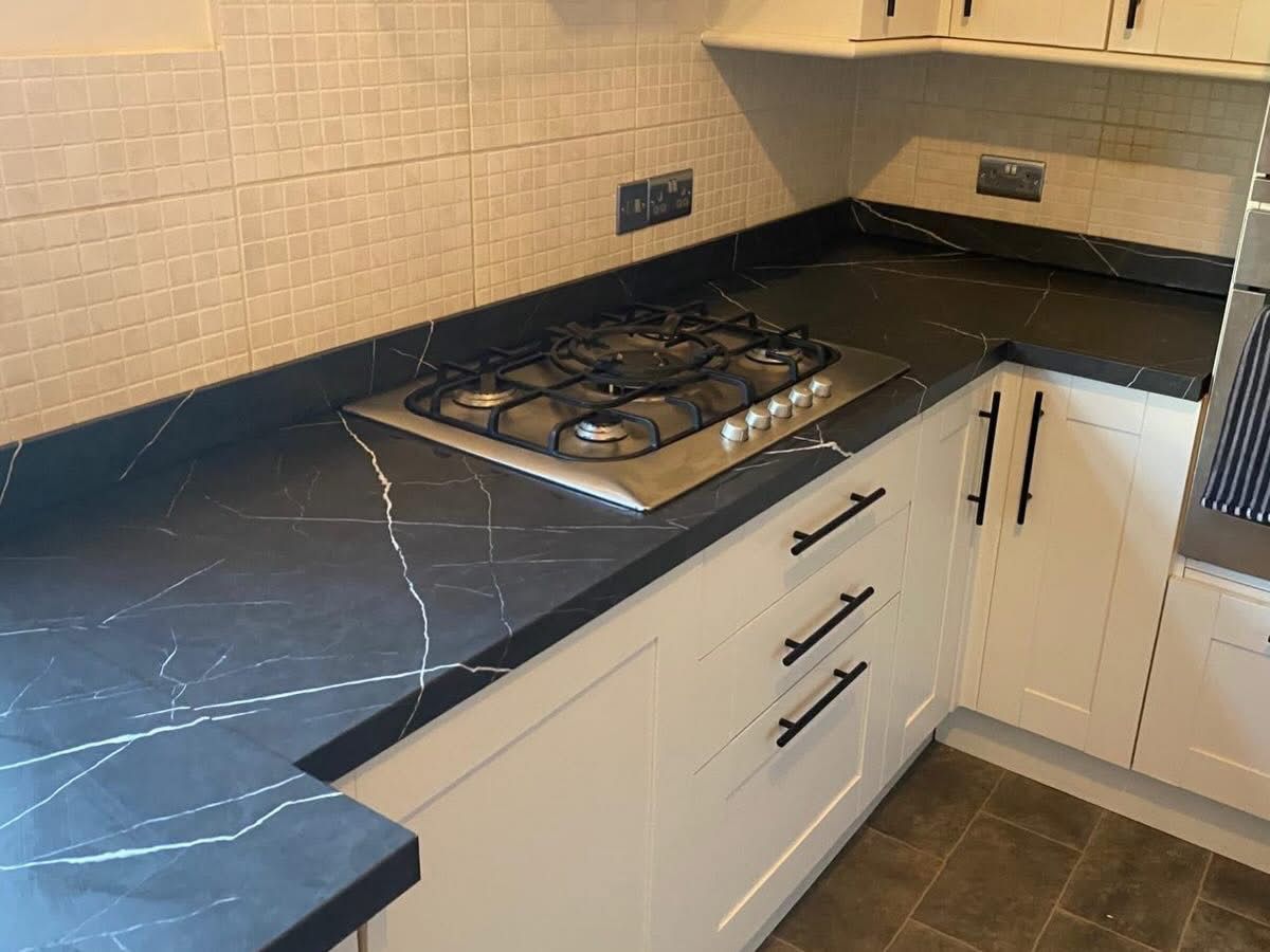 Black marble vinyl wrap worktop after