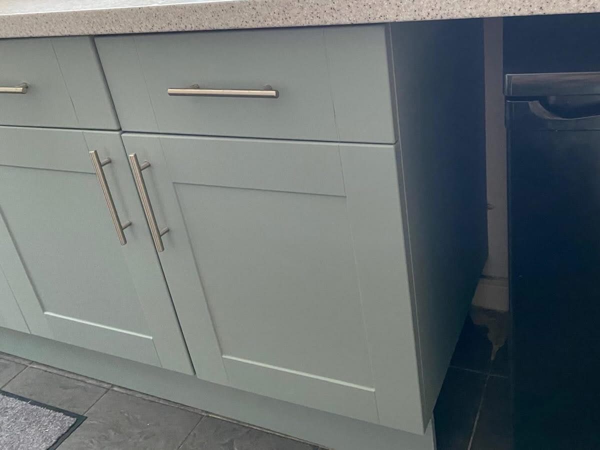 Sage green cabinet doors close up