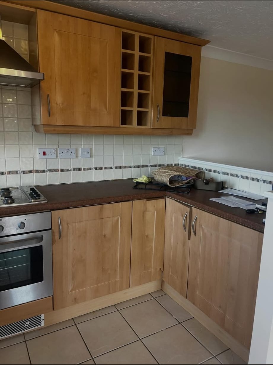 Dated oak kitchen cabinets and corner units before vinyl wrap